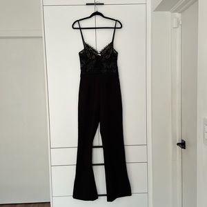 Miss Circle black jumpsuit. Stretch, lace top (lined bra).